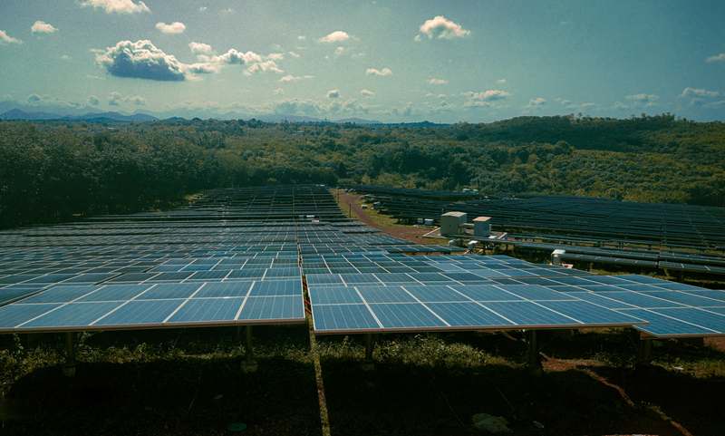 Rooftop installation of bifacial solar panels capturing sunlight from both sides